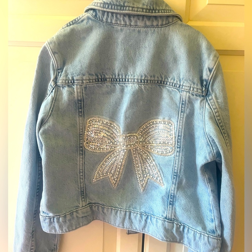 Brand new Jean jacket with bow patch